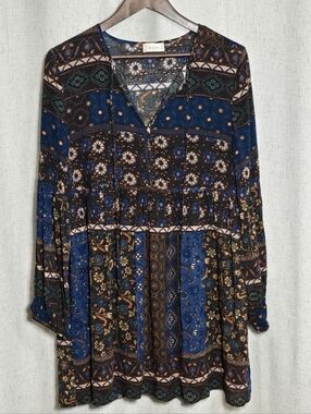 Altar'd State peasant-style dress With a bohemian pattern.